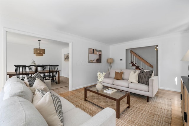 8121 Blind Brook Ct, Columbus, OH 43235 - living area featuring light wood-style flooring, crown molding, and stairs