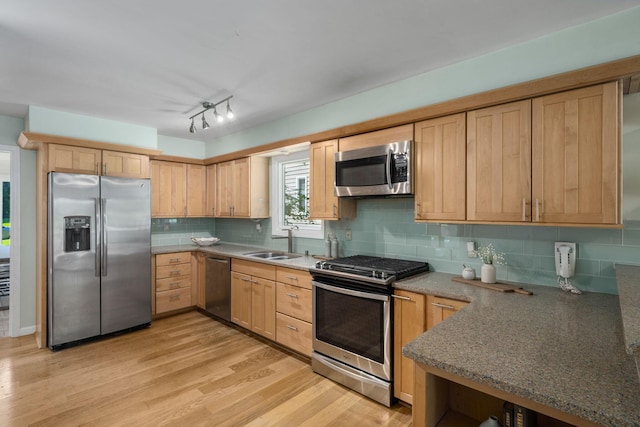 8121 Blind Brook Ct, Columbus, OH 43235 - kitchen with appliances with stainless steel finishes, light brown cabinets, light wood-style floors, and backsplash