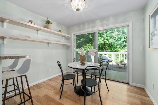 8121 Blind Brook Ct, Columbus, OH 43235 - dining space featuring light wood-style flooring and a baseboard heating unit