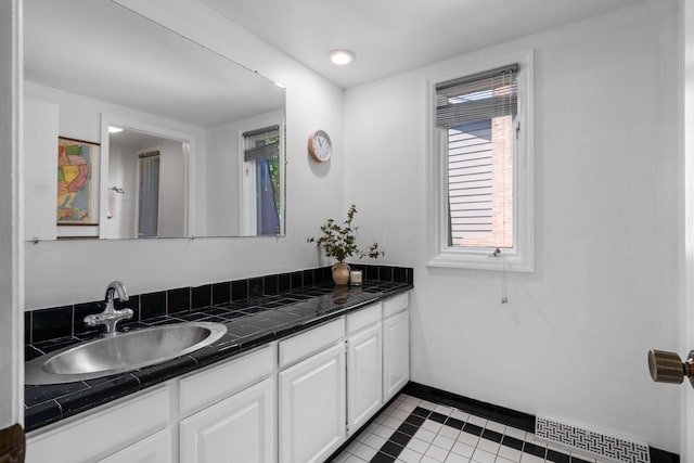 8121 Blind Brook Ct, Columbus, OH 43235 - bathroom with tile patterned flooring, vanity, and inlaid floor details
