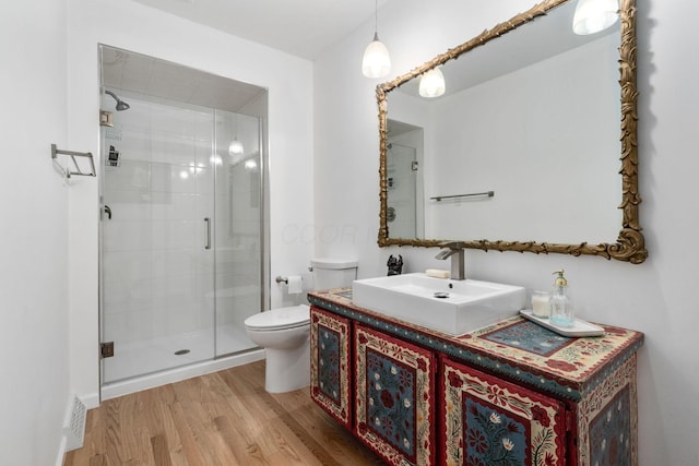 8121 Blind Brook Ct, Columbus, OH 43235 - bathroom with wood finished floors, a stall shower, and vanity