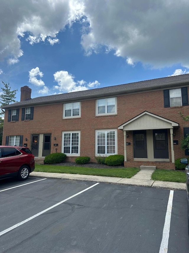 1342-48 Palmer House Ct Unit D, Columbus, OH 43235 - view of property featuring uncovered parking