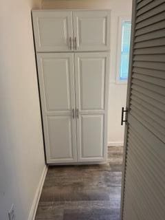 130 N 11th St, Newark, OH 43055 - corridor with baseboards and dark wood-style flooring