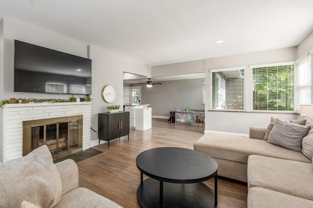 1942 Langham Rd, Upper Arlington, OH 43221 - living area with healthy amount of natural light, wood finished floors, a brick fireplace, and recessed lighting