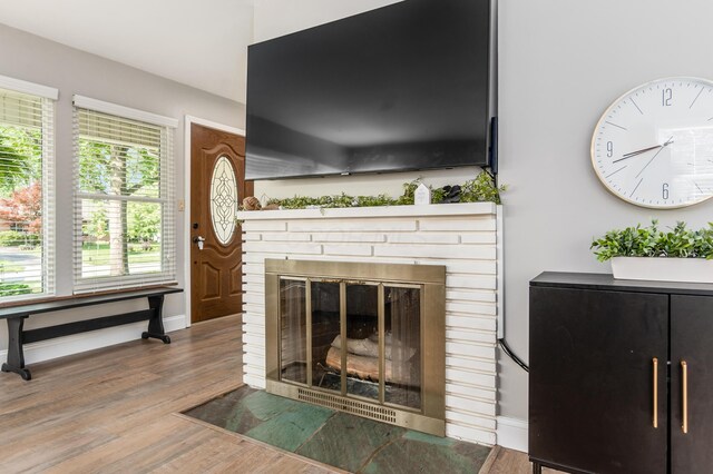 1942 Langham Rd, Upper Arlington, OH 43221 - detailed view of wood finished floors, a brick fireplace, and baseboards