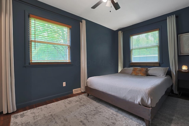 1186 State Route 314 S, Mansfield, OH 44903 - bedroom featuring multiple windows, lofted ceiling, wood finished floors, a ceiling fan, and baseboards