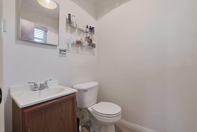 1186 State Route 314 S, Mansfield, OH 44903 - half bathroom with toilet, vanity, and baseboards