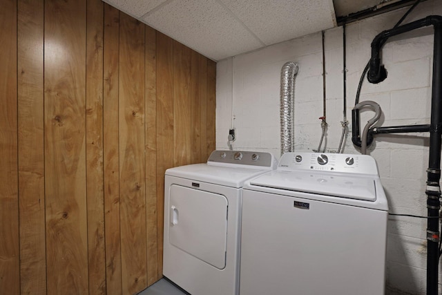 1186 State Route 314 S, Mansfield, OH 44903 - laundry room with concrete block wall, washer and clothes dryer, and wooden walls