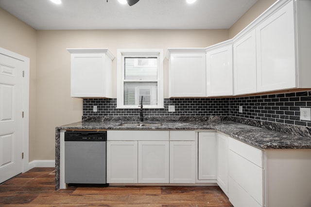 463 E Woodrow Ave, Columbus, OH 43207 - kitchen with stainless steel dishwasher, a sink, backsplash, white cabinetry, and recessed lighting