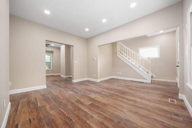 463 E Woodrow Ave, Columbus, OH 43207 - unfurnished room featuring hardwood / wood-style flooring, stairs, baseboards, and recessed lighting