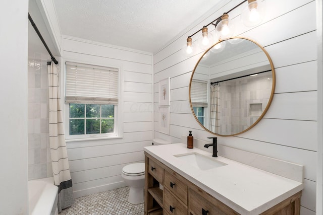 128 S Kellner Rd, Columbus, OH 43209 - bathroom with vanity, toilet, tile patterned flooring, a textured ceiling, and shower / bath combo with shower curtain