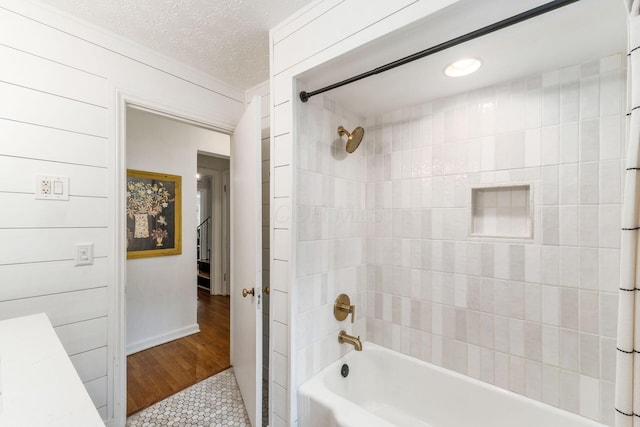 128 S Kellner Rd, Columbus, OH 43209 - full bath with  shower combination, tile patterned floors, and a textured ceiling