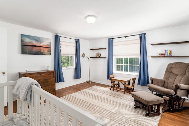 128 S Kellner Rd, Columbus, OH 43209 - bedroom with wood finished floors, multiple windows, and baseboards
