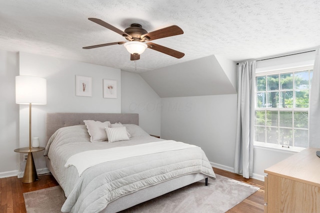 128 S Kellner Rd, Columbus, OH 43209 - bedroom with wood finished floors, baseboards, a textured ceiling, and a ceiling fan