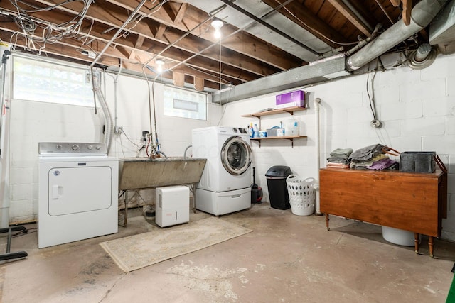 128 S Kellner Rd, Columbus, OH 43209 - basement featuring washing machine and clothes dryer, a sink, healthy amount of natural light, and concrete block wall
