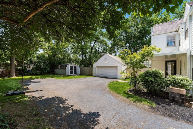 128 S Kellner Rd, Columbus, OH 43209 - detached garage featuring a storage unit and central air condition unit