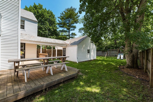128 S Kellner Rd, Columbus, OH 43209 - view of yard featuring outdoor dining area, an outbuilding, a wooden deck, and a playground