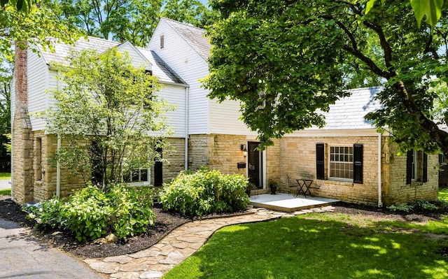 128 S Kellner Rd, Columbus, OH 43209 - view of front of home with stone siding and a front yard