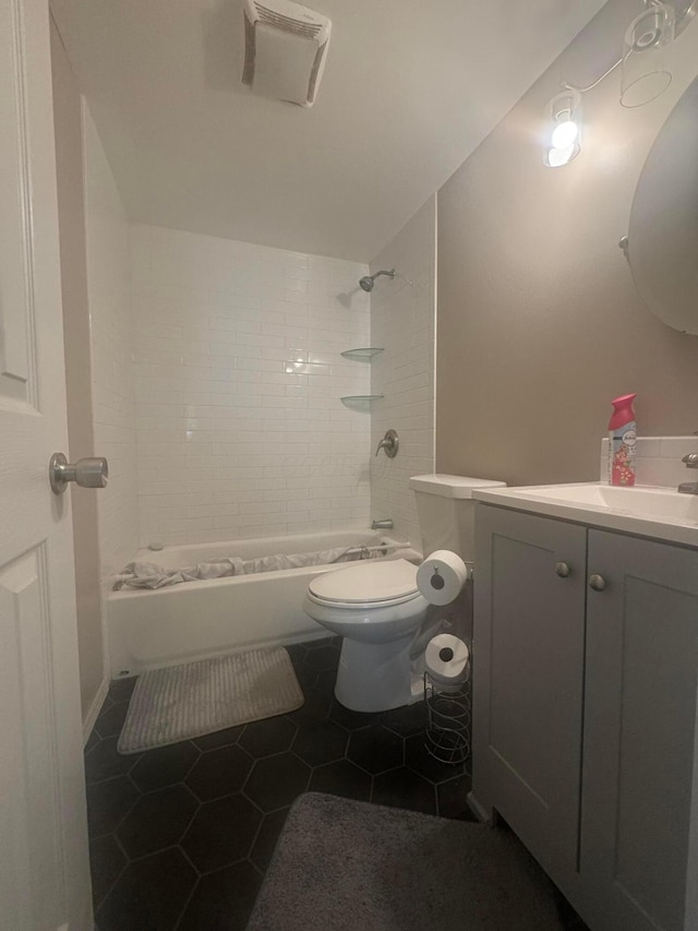 53 State St, Jeffersonville, OH 43128 - bathroom with vanity, toilet, shower / tub combination, and tile patterned flooring