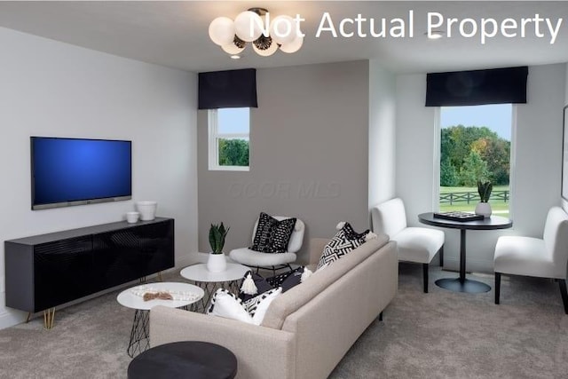 3323 Tender Ave Lot 7165, Powell, OH 43065 - carpeted living area featuring healthy amount of natural light and a chandelier