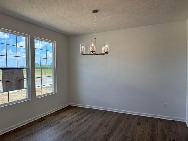 3323 Tender Ave Lot 7165, Powell, OH 43065 - empty room with a chandelier, dark wood-type flooring, and a textured ceiling