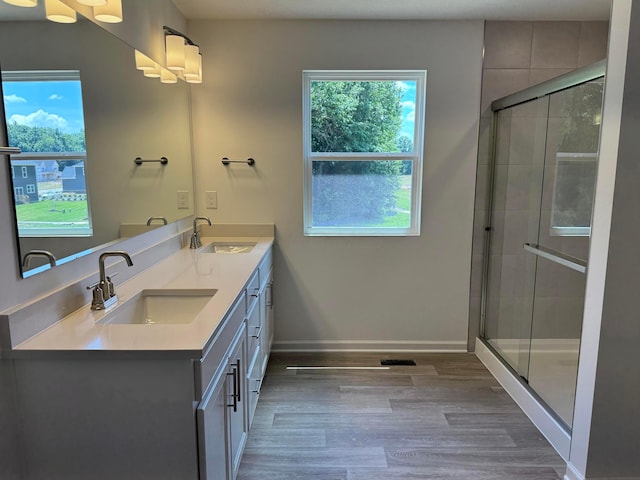 3323 Tender Ave Lot 7165, Powell, OH 43065 - bathroom with double vanity, wood finished floors, and a stall shower