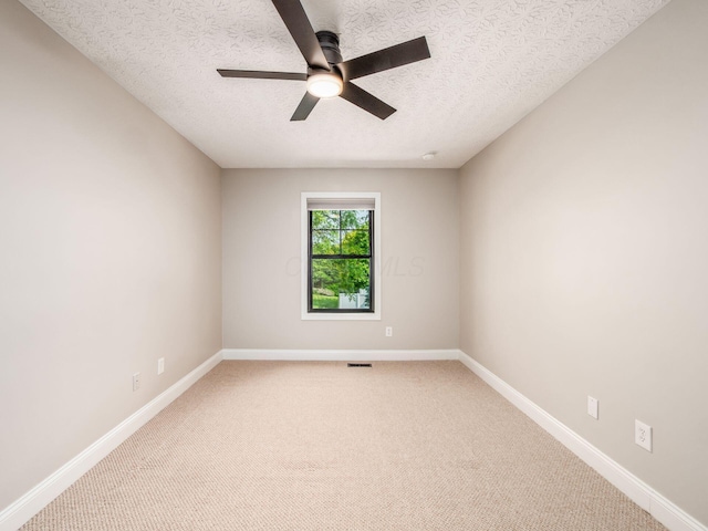 3579 Aaron Dr, Columbus, OH 43228 - empty room featuring a ceiling fan, light carpet, a textured ceiling, and baseboards