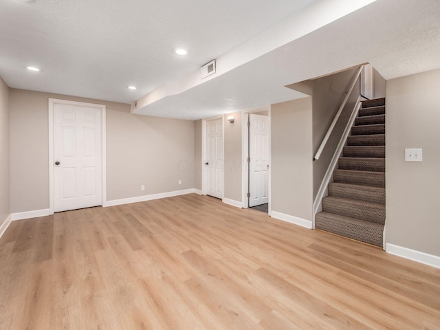 3579 Aaron Dr, Columbus, OH 43228 - finished basement featuring stairs, light wood-style floors, baseboards, and recessed lighting