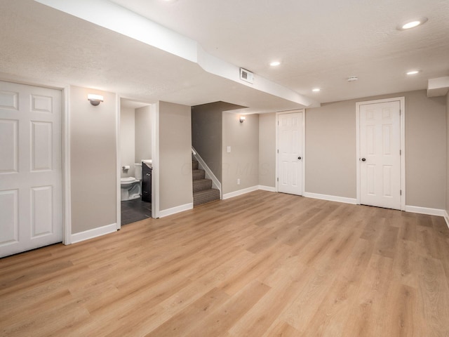 3579 Aaron Dr, Columbus, OH 43228 - finished below grade area featuring baseboards, light wood finished floors, recessed lighting, and stairway