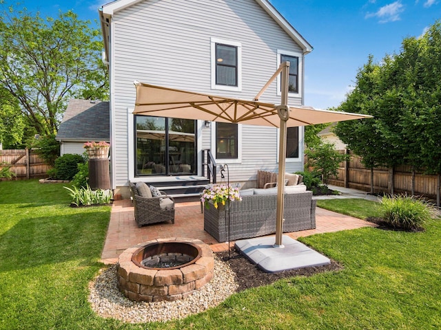 3579 Aaron Dr, Columbus, OH 43228 - rear view of property featuring a patio and an outdoor living space with a fire pit