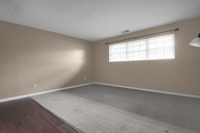 1530 Slade Ave Unit 103, Columbus, OH 43235 - empty room with baseboards, wood finished floors, and carpet