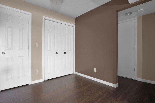 1530 Slade Ave Unit 103, Columbus, OH 43235 - unfurnished bedroom with baseboards, dark wood-style flooring, and a closet