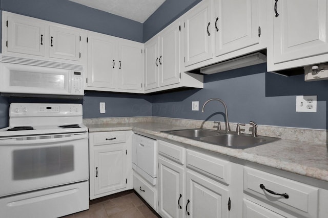 1530 Slade Ave Unit 103, Columbus, OH 43235 - kitchen featuring white appliances, a sink, light countertops, and white cabinets