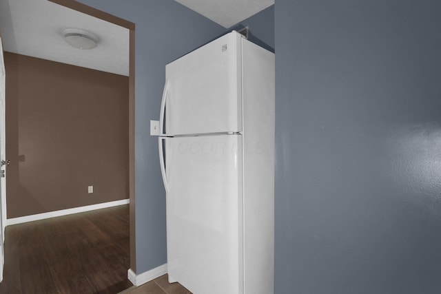 1530 Slade Ave Unit 103, Columbus, OH 43235 - kitchen with freestanding refrigerator, baseboards, and dark wood-type flooring