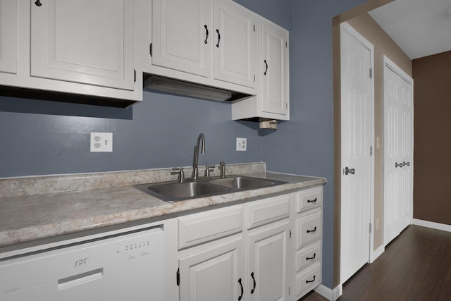1530 Slade Ave Unit 103, Columbus, OH 43235 - kitchen featuring white dishwasher, a sink, light countertops, white cabinets, and baseboards