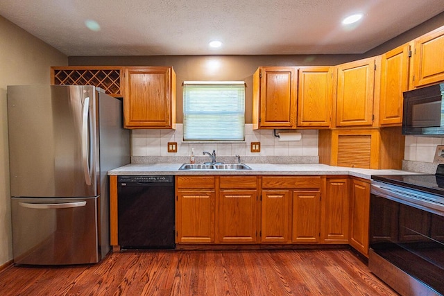 5102 Avalon Ave, Columbus, OH 43229 - kitchen featuring black appliances, light countertops, dark wood finished floors, and recessed lighting
