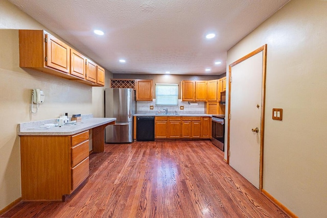 5102 Avalon Ave, Columbus, OH 43229 - kitchen with black appliances, dark wood-style floors, light countertops, decorative backsplash, and recessed lighting