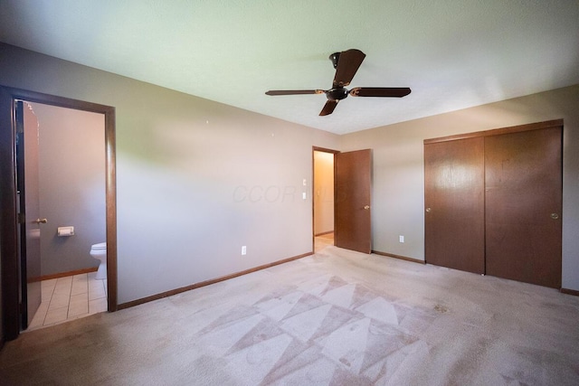 5102 Avalon Ave, Columbus, OH 43229 - unfurnished bedroom with ensuite bathroom, carpet, a closet, and a ceiling fan