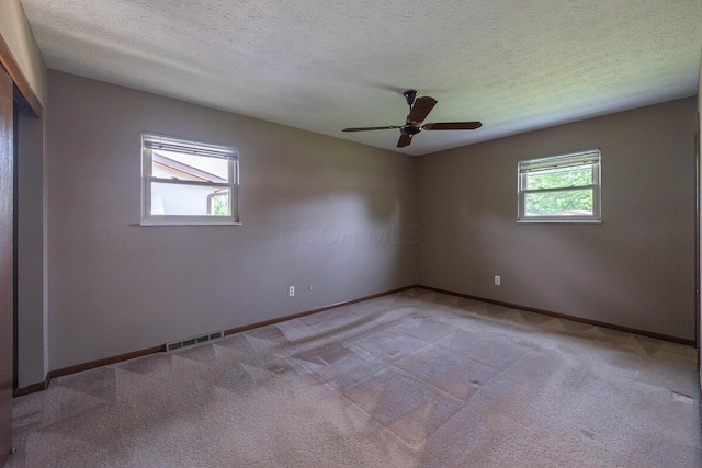 5102 Avalon Ave, Columbus, OH 43229 - carpeted empty room with a ceiling fan and a textured ceiling