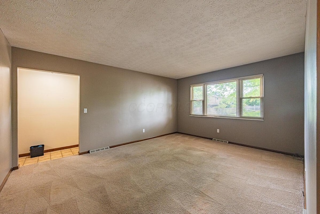 5102 Avalon Ave, Columbus, OH 43229 - carpeted spare room featuring baseboards and a textured ceiling