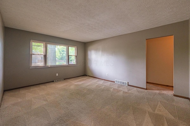 5102 Avalon Ave, Columbus, OH 43229 - spare room with carpet and a textured ceiling