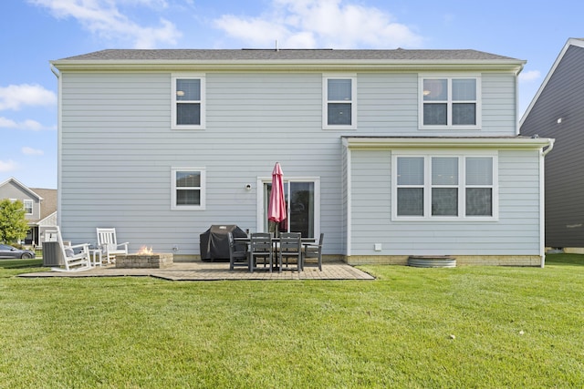 185 Saffron Dr, Sunbury, OH 43074 - back of property featuring a patio area, a yard, and an outdoor fire pit