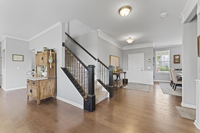 185 Saffron Dr, Sunbury, OH 43074 - entryway featuring stairs, crown molding, dark wood finished floors, baseboards, and a textured ceiling