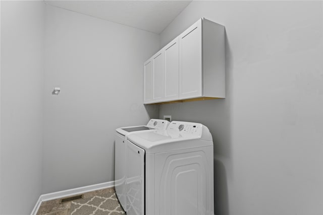 185 Saffron Dr, Sunbury, OH 43074 - laundry area with washing machine and clothes dryer, cabinet space, baseboards, and carpet floors