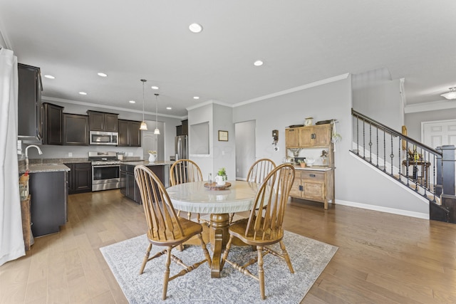 185 Saffron Dr, Sunbury, OH 43074 - dining room featuring recessed lighting, ornamental molding, stairs, wood finished floors, and baseboards