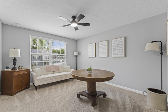 185 Saffron Dr, Sunbury, OH 43074 - carpeted living area with ceiling fan, baseboards, and a textured ceiling