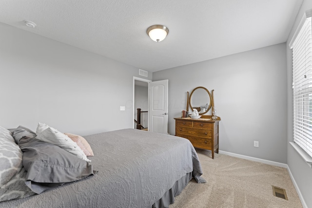 185 Saffron Dr, Sunbury, OH 43074 - bedroom with multiple windows, light colored carpet, and baseboards