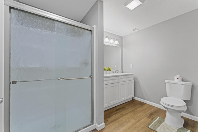 185 Saffron Dr, Sunbury, OH 43074 - bathroom featuring vanity, a shower stall, wood finished floors, toilet, and baseboards