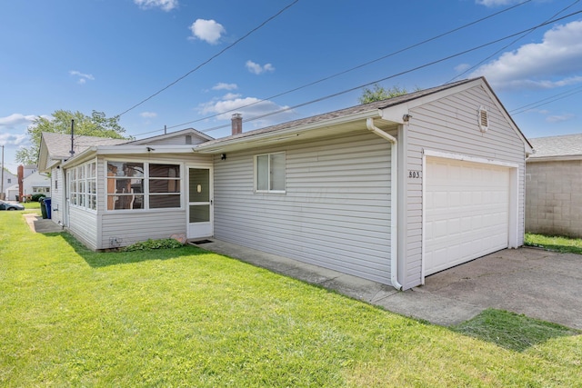 803 Wiltshire Rd, Columbus, OH 43204 - view of side of property with a garage, driveway, a yard, and roof with shingles