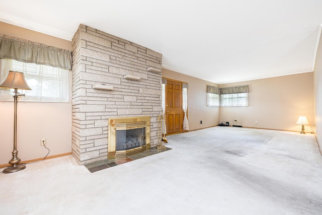 803 Wiltshire Rd, Columbus, OH 43204 - unfurnished living room with carpet, baseboards, and a fireplace
